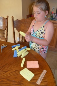 Cut the strips out. This is much easier if the sponges are soft, not dried out and hard.
